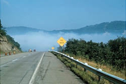 foggy area ahead on road