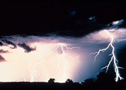 a large storm cloud with lightning